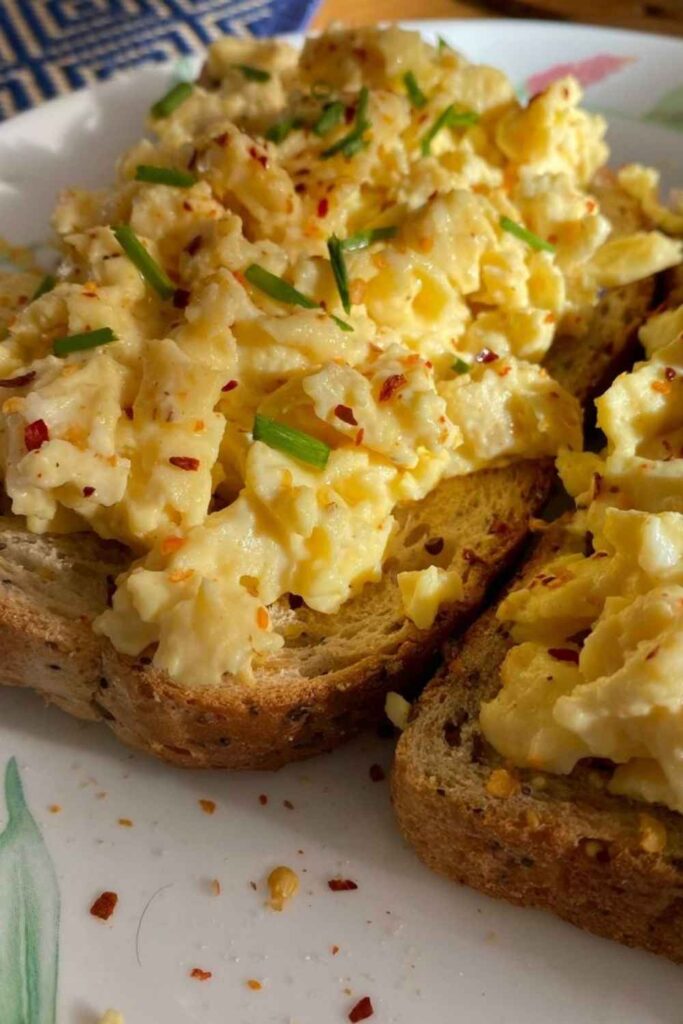 Scrambled Eggs With Toast and Hot Sauce