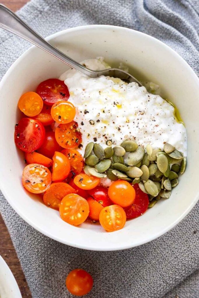Cottage Cheese With Sliced Tomatoes and Black Pepper